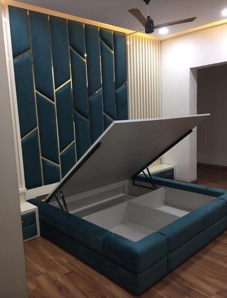 Teal upholstered bed with hydraulic lift storage